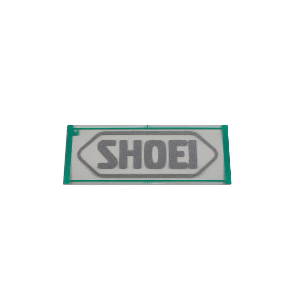 RECAMBIO SHOEI LOGO FRONTAL 82MM RJ PLATINUM-R / S-20 PLATA MATE -