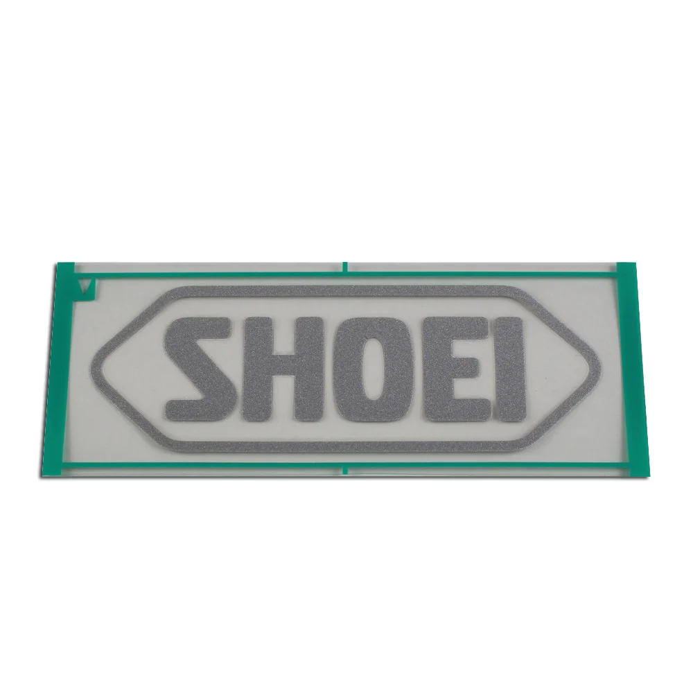 RECAMBIO SHOEI LOGO FRONTAL 95MM GRIS MATE -